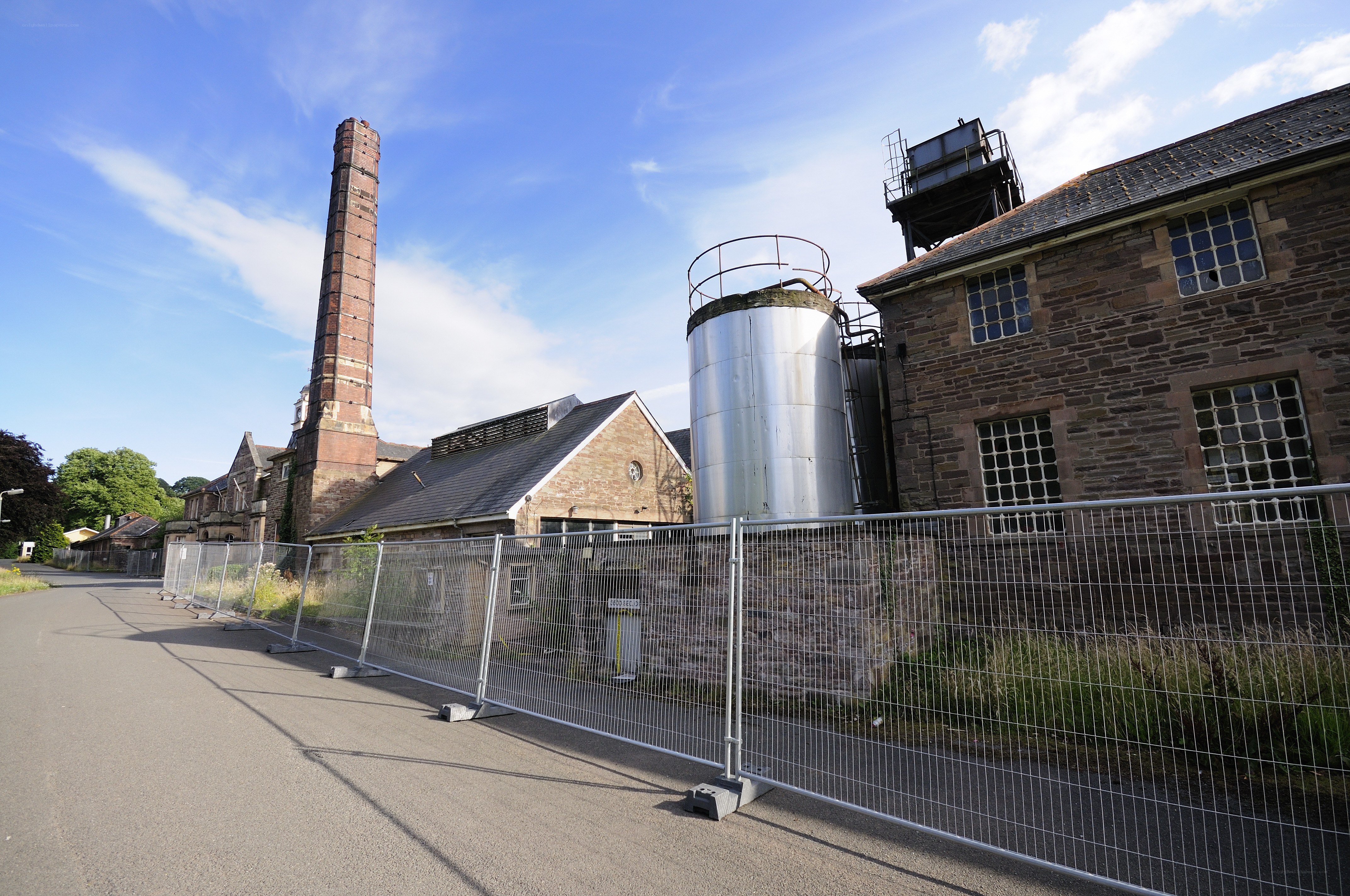Abandoned industrial site with chimney