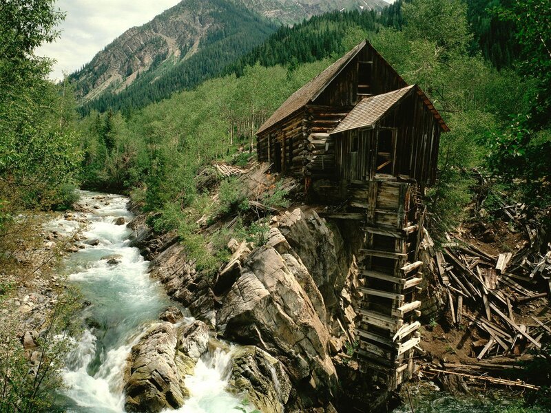 Abandoned mill by a mountain river