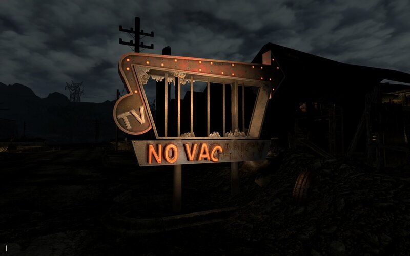 abandoned motel sign at night