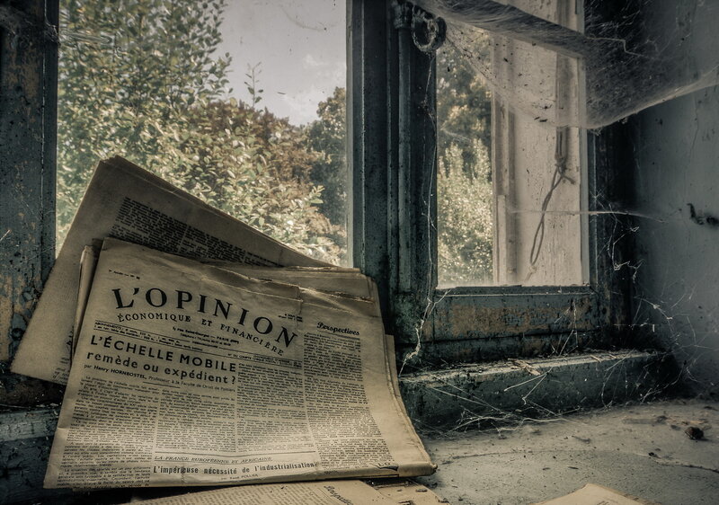 Abandoned Newspaper on Windowsill