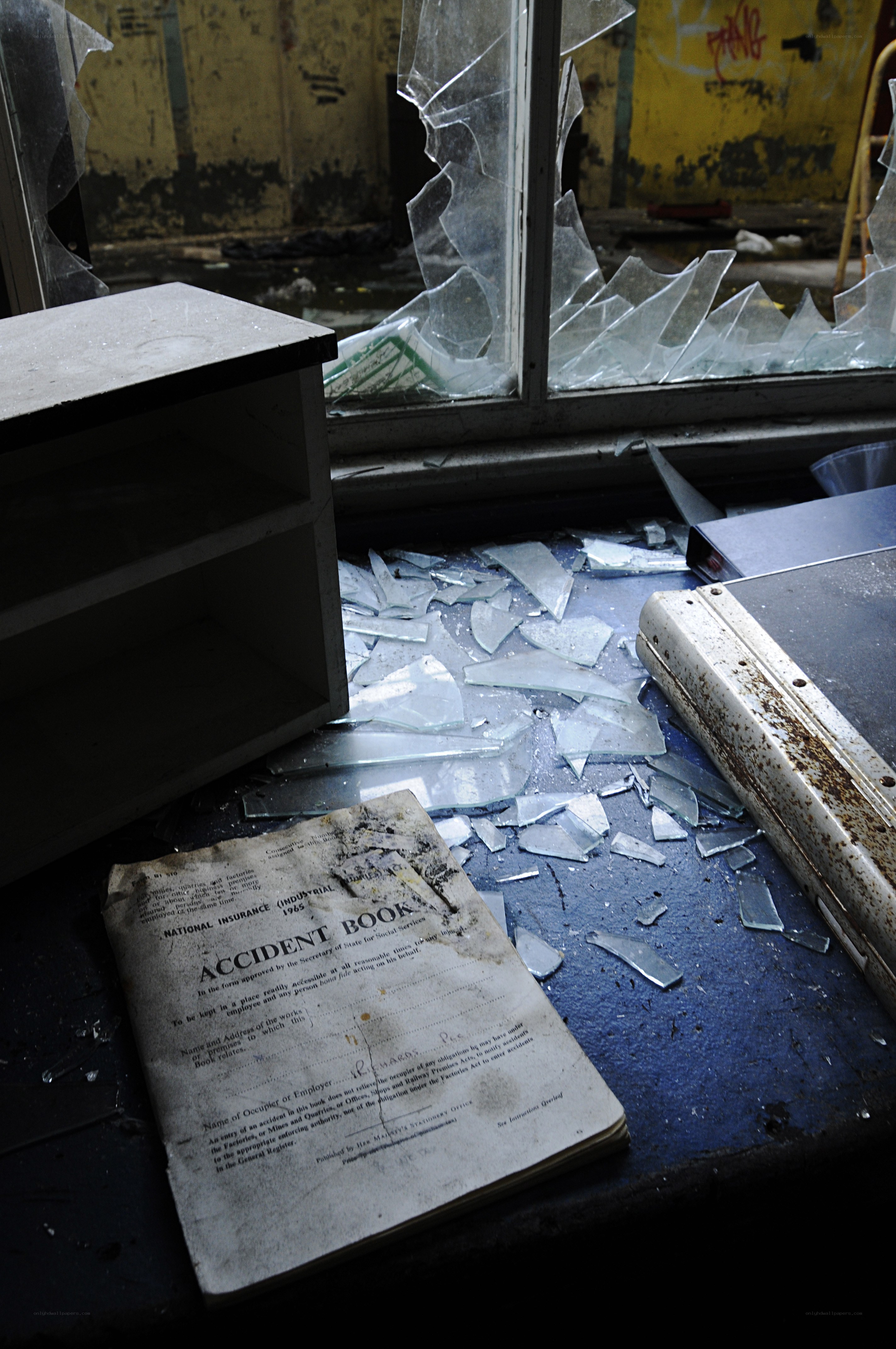 abandoned office with broken glass