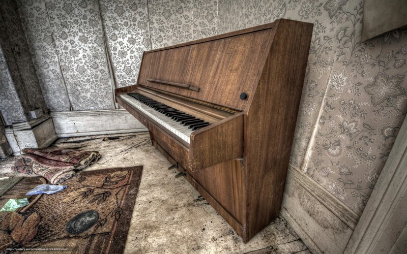 abandoned piano in a derelict room