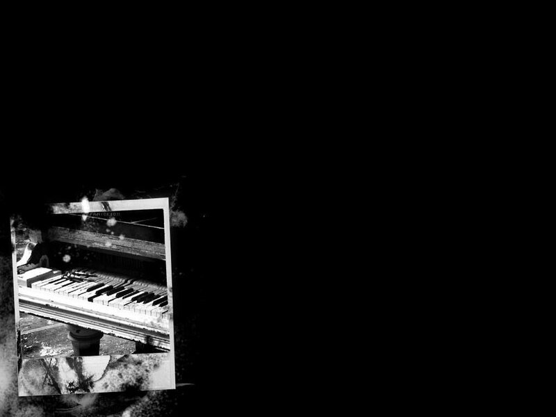 abandoned piano in dark room