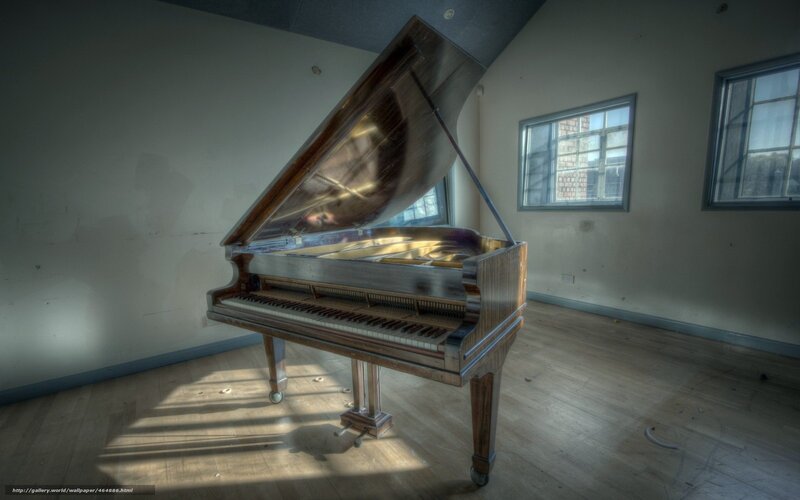 abandoned piano in empty room