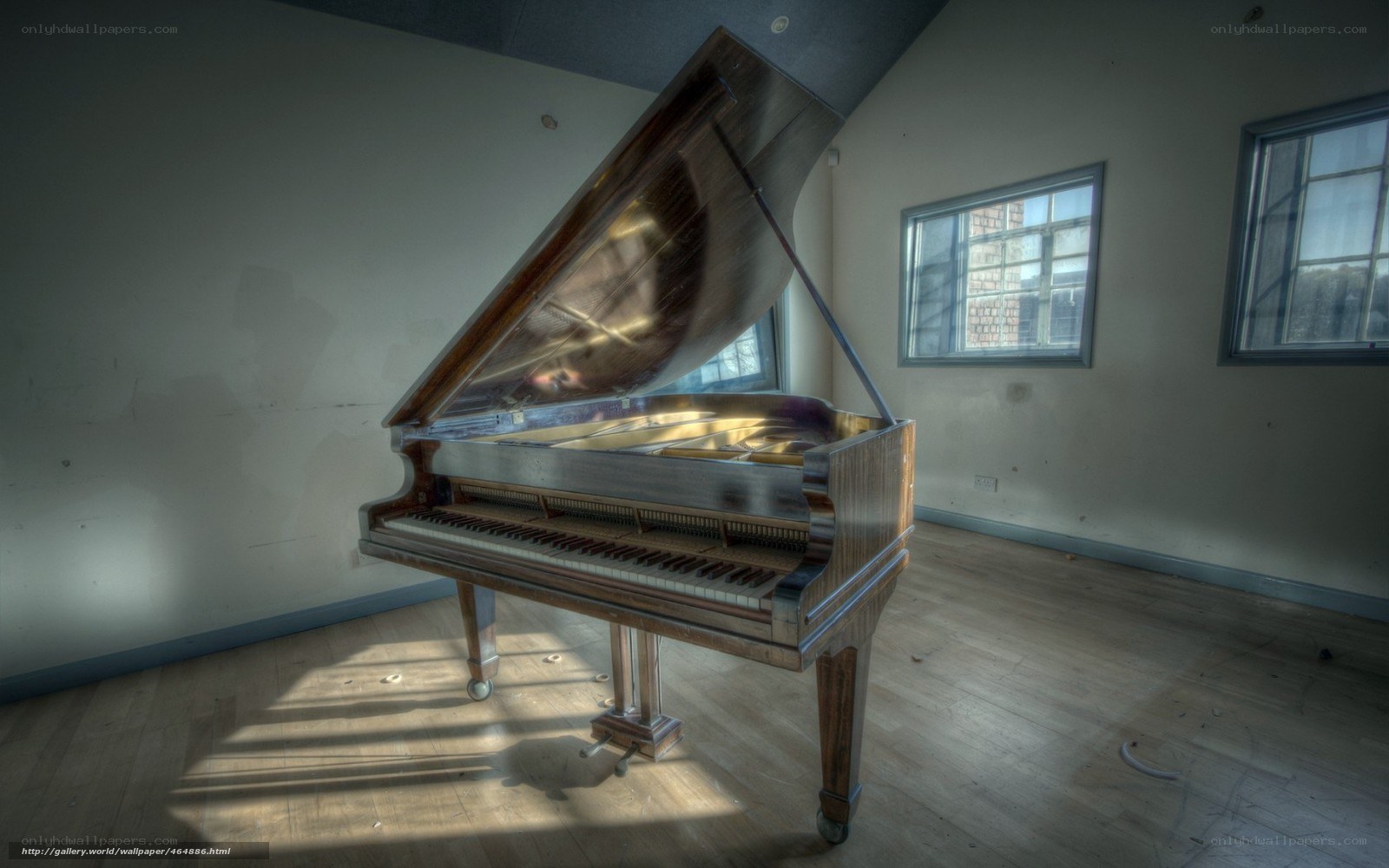 abandoned piano in empty room