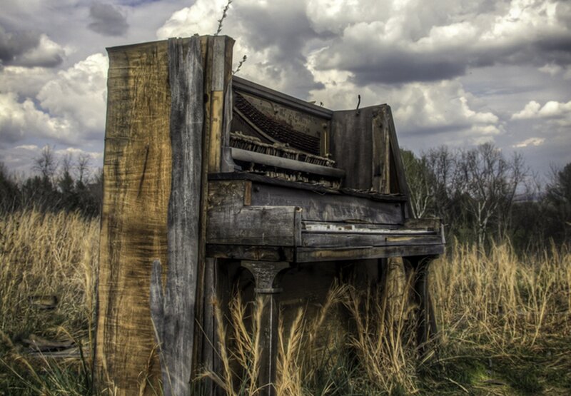 Abandoned Piano in Field