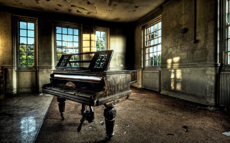 Abandoned Piano in Room