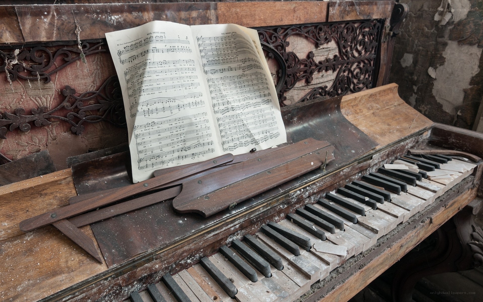 abandoned piano with sheet music