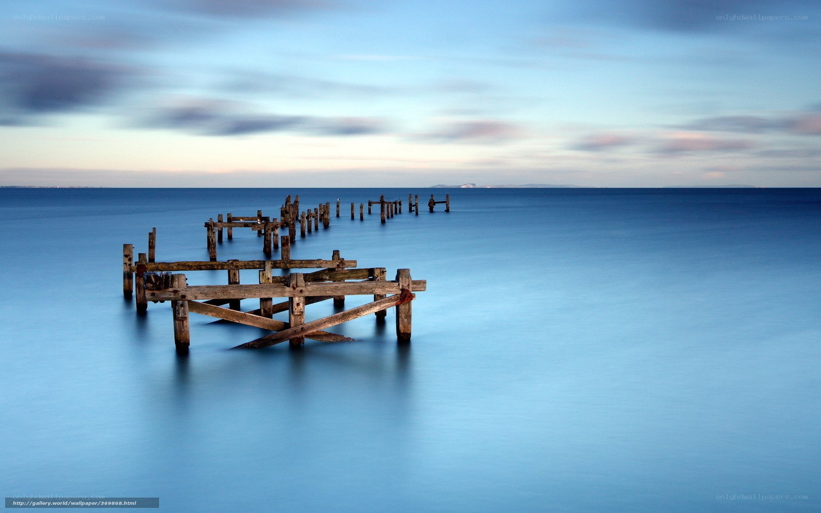 Abandoned pier at dusk