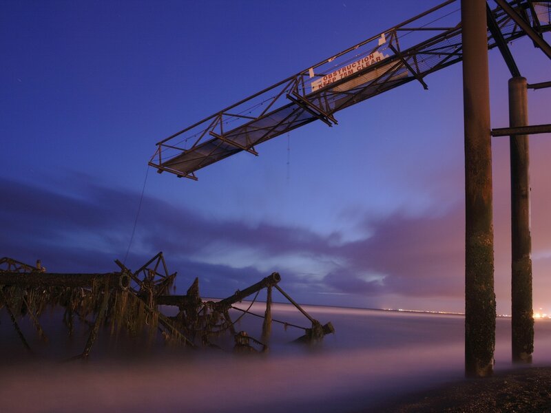 Abandoned pier at dusk