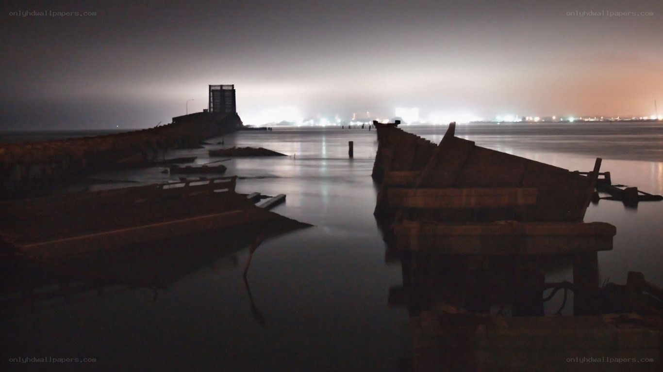 abandoned pier at night