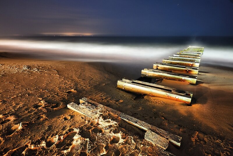 Abandoned pier at night