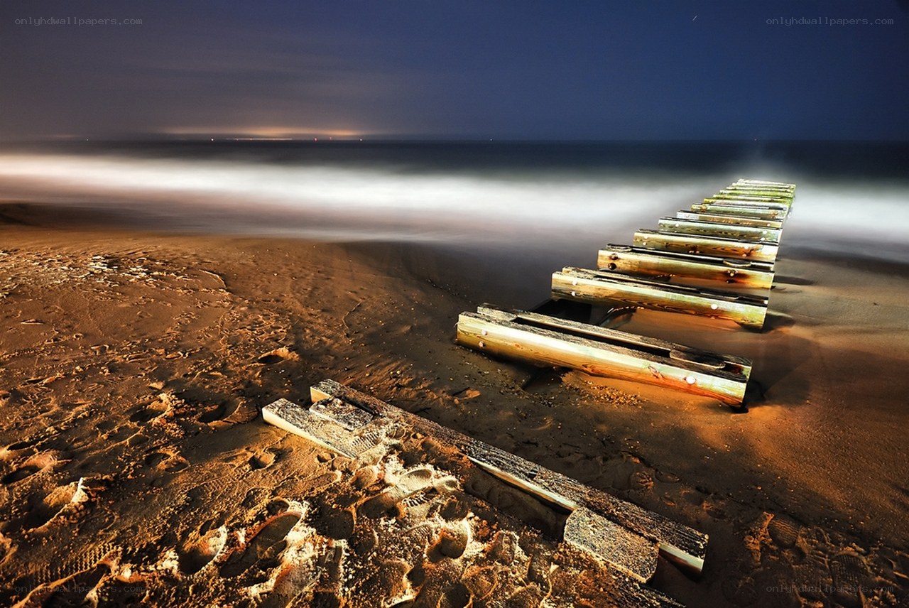 Abandoned pier at night