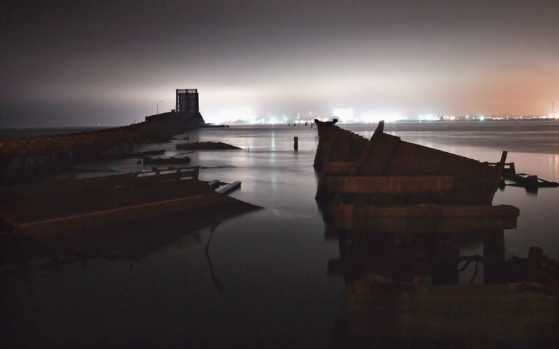 abandoned pier at night