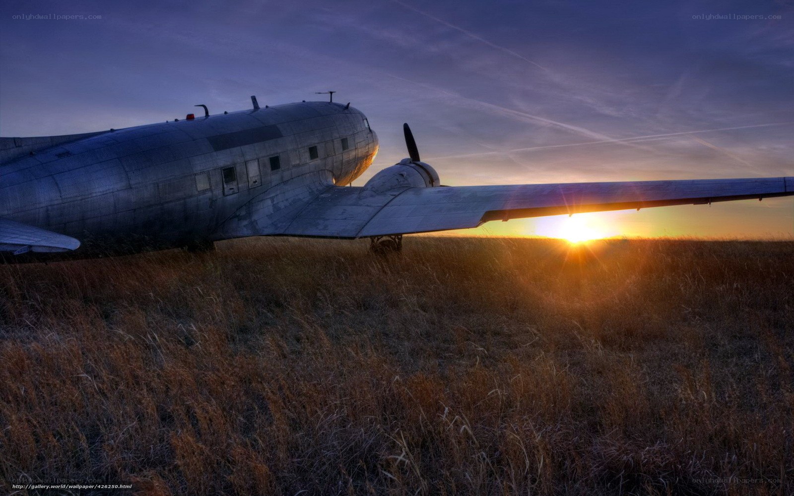 abandoned plane at sunset
