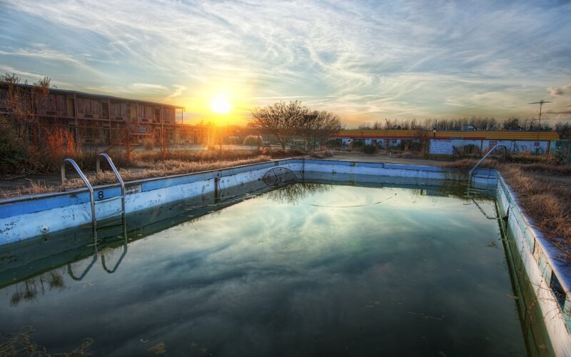 Abandoned pool at sunset