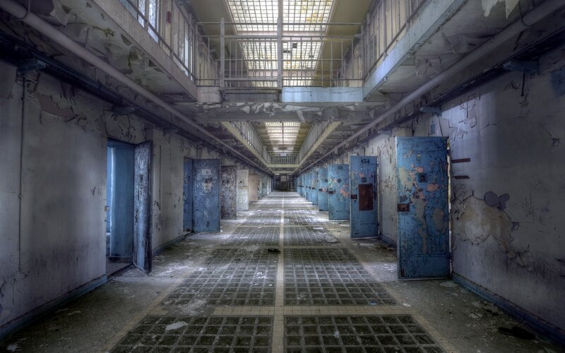 Abandoned Prison Corridor — Gray, Desolate
