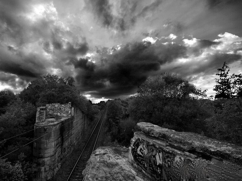 Abandoned Railway Bridge — Black, Dramatic, Photograph, Rail Tracks, Graffiti, Trees, White