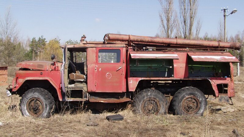 abandoned red fire truck