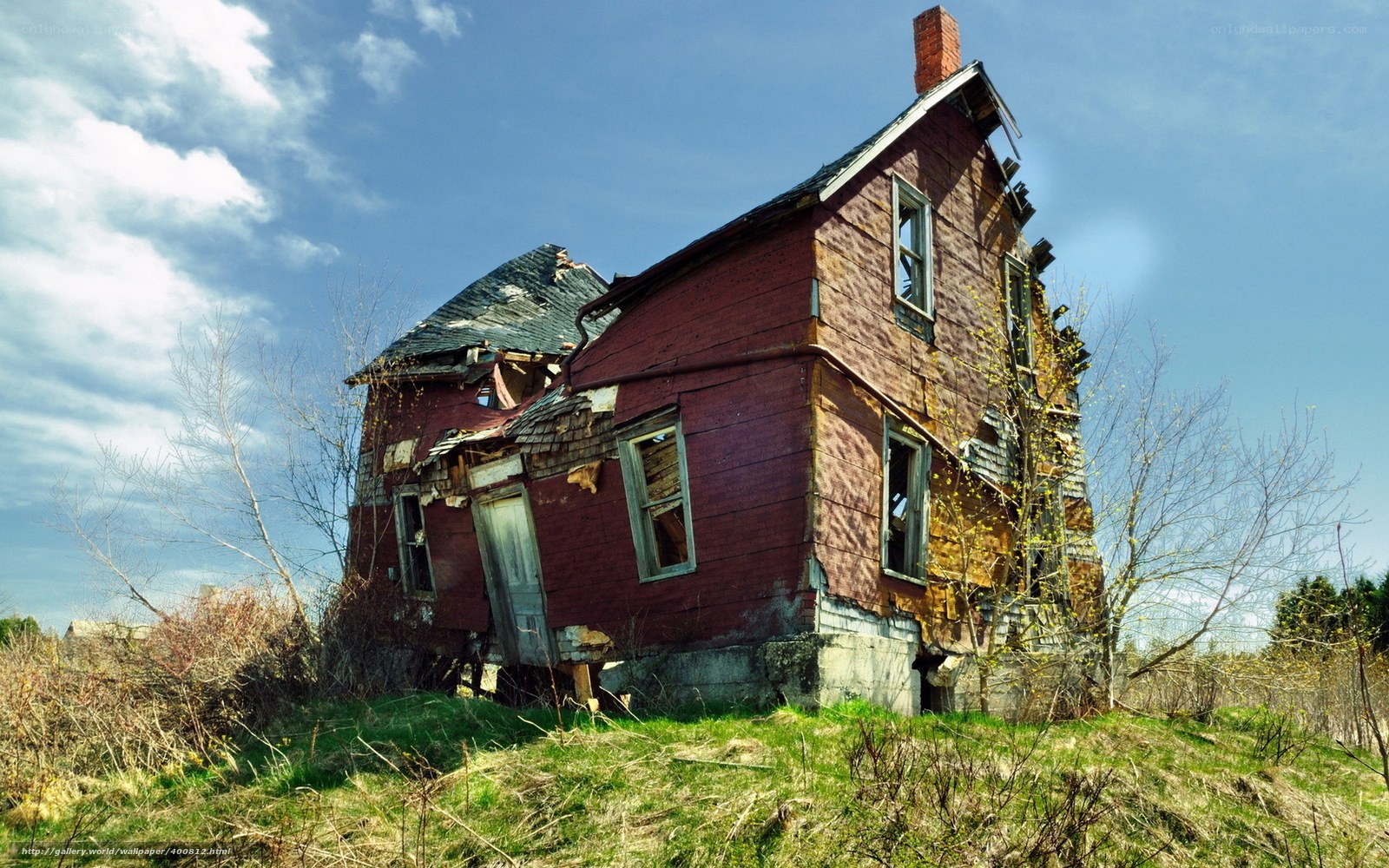 Abandoned red house on hill