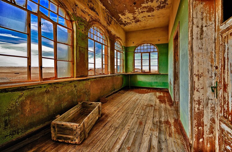 abandoned room with arched windows
