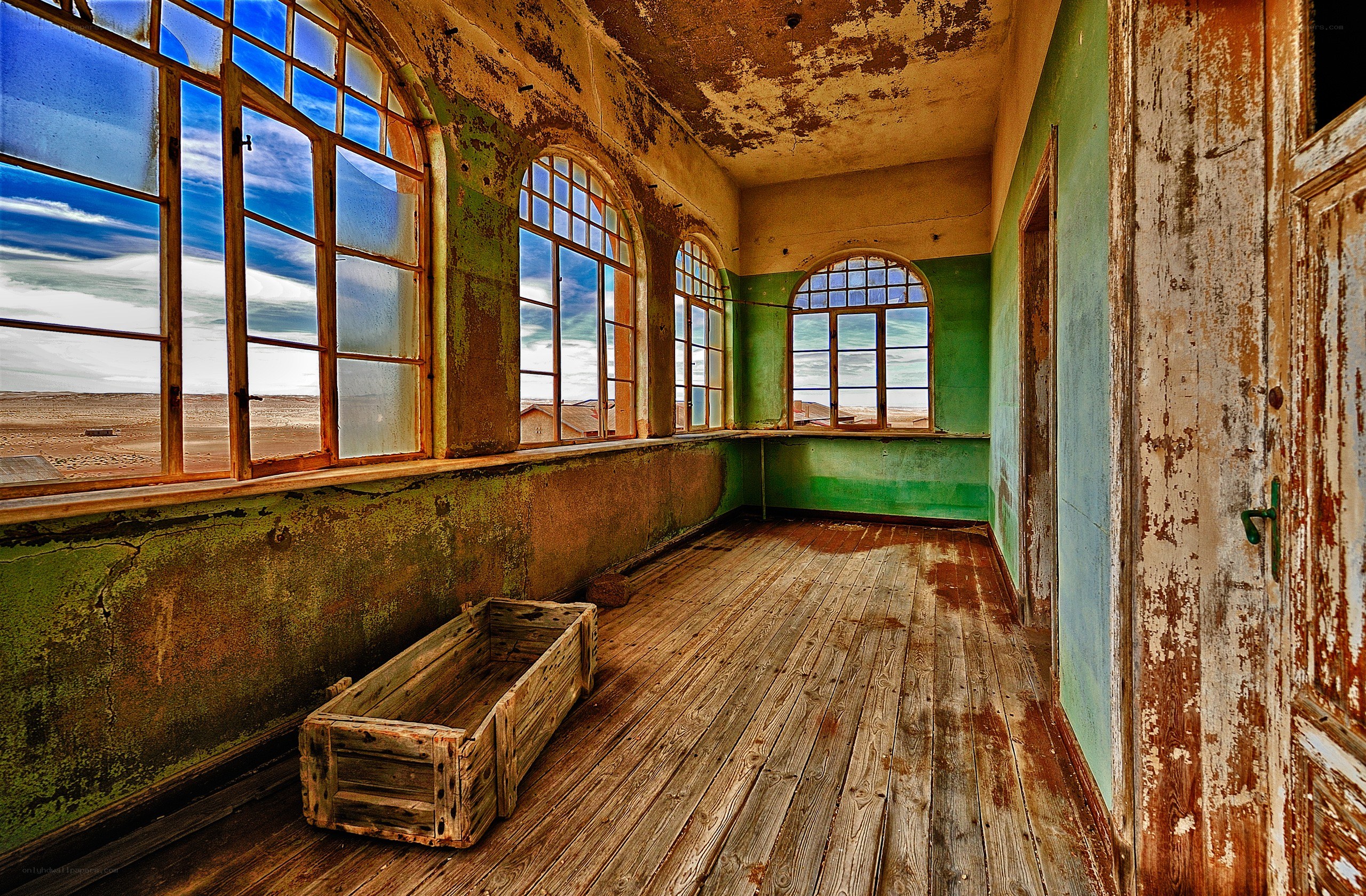 abandoned room with arched windows