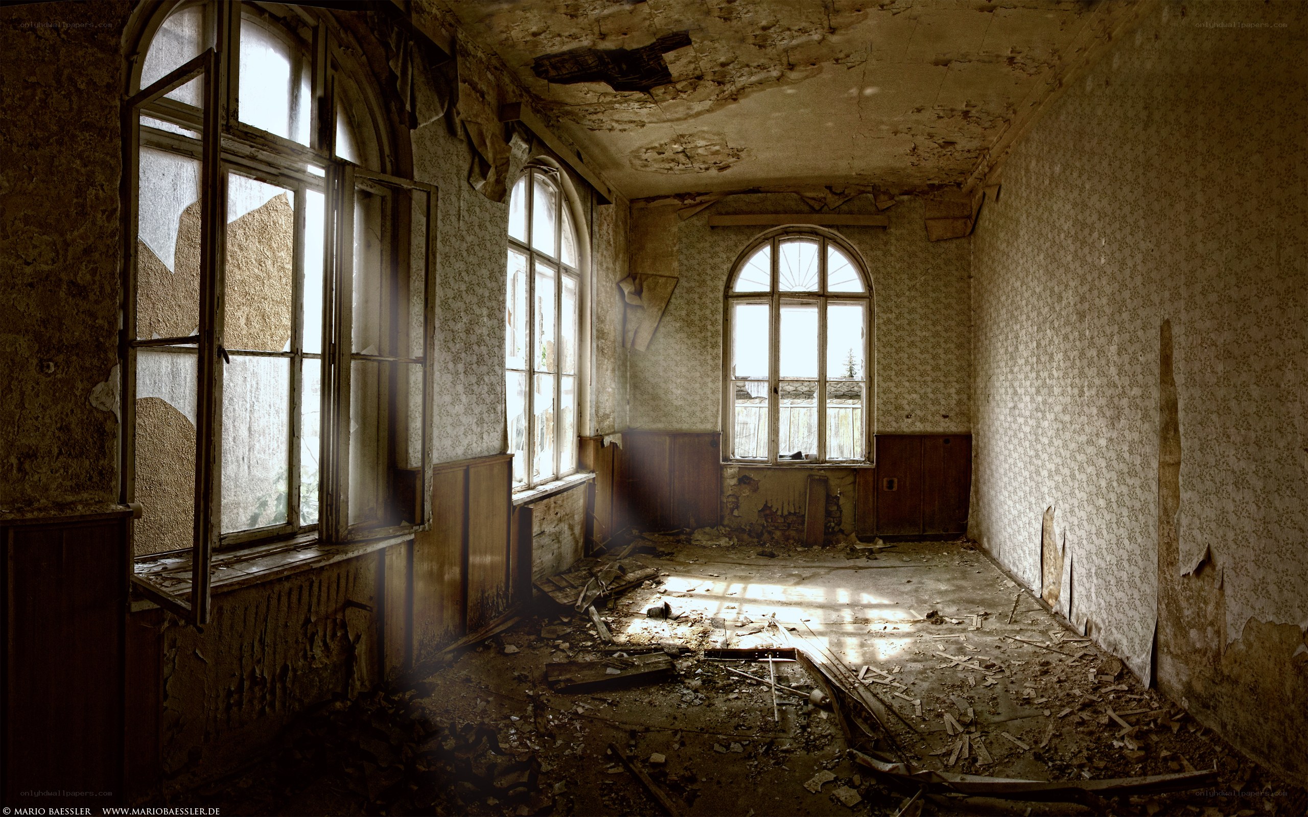Abandoned room with arched windows