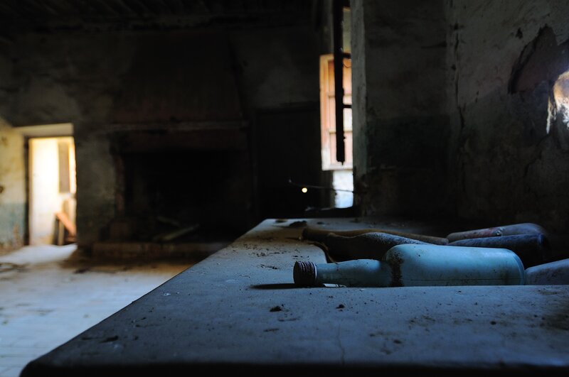 abandoned room with bottles