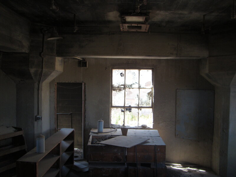 abandoned room with broken window