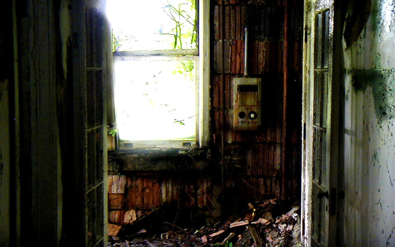 abandoned room with broken window