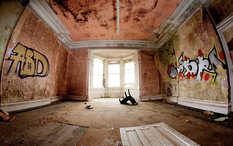 abandoned room with graffiti