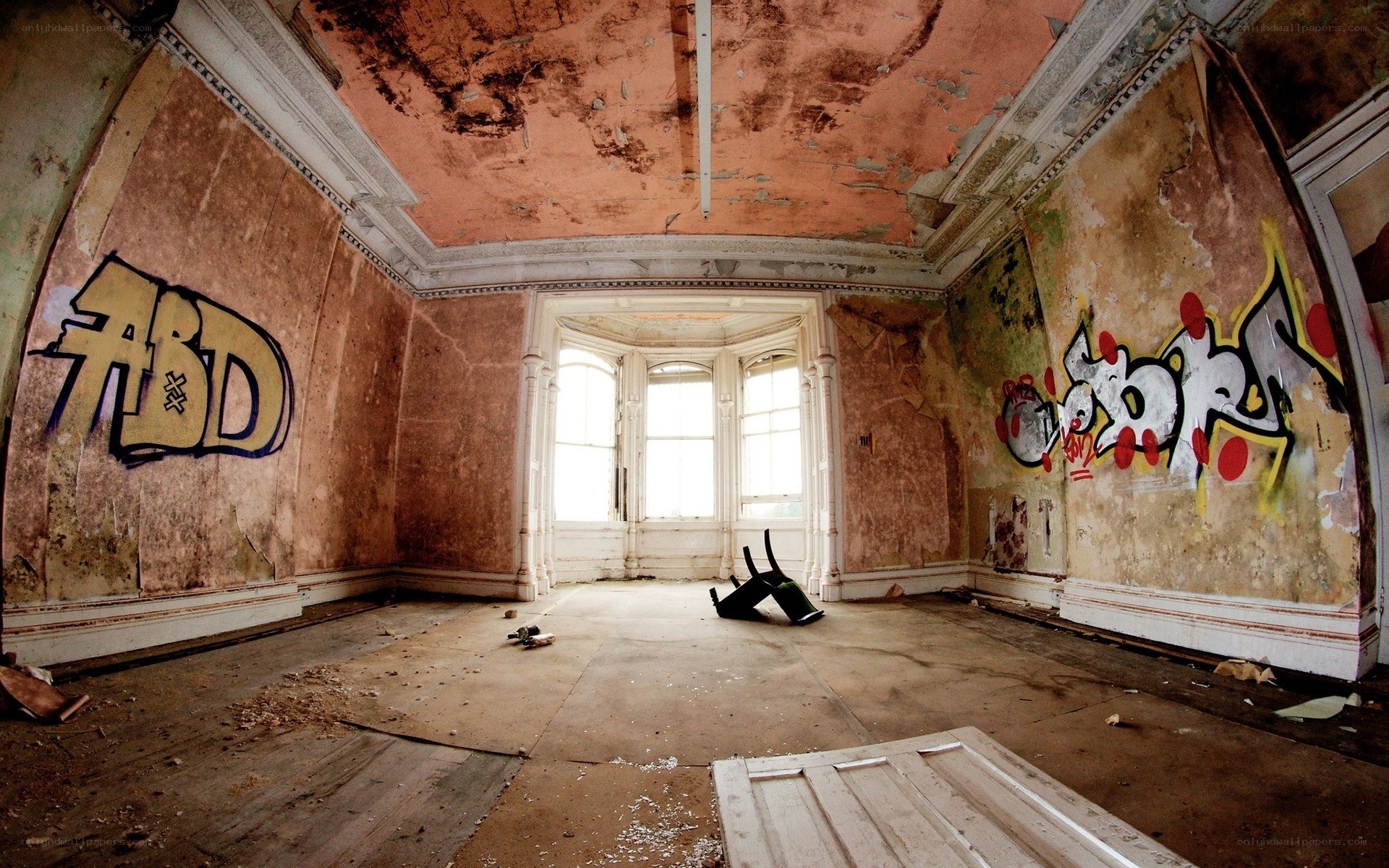 abandoned room with graffiti