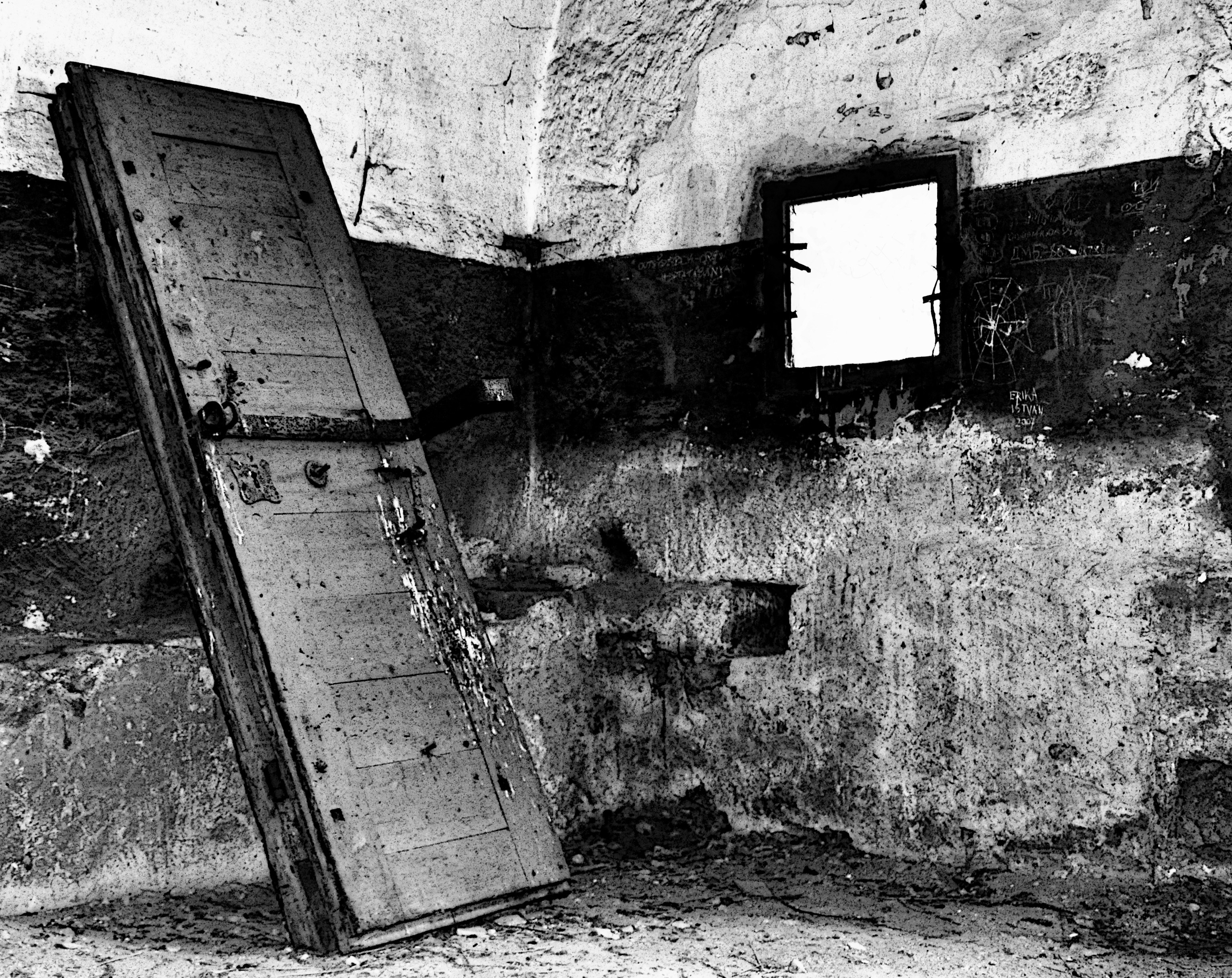 Abandoned room with leaning door