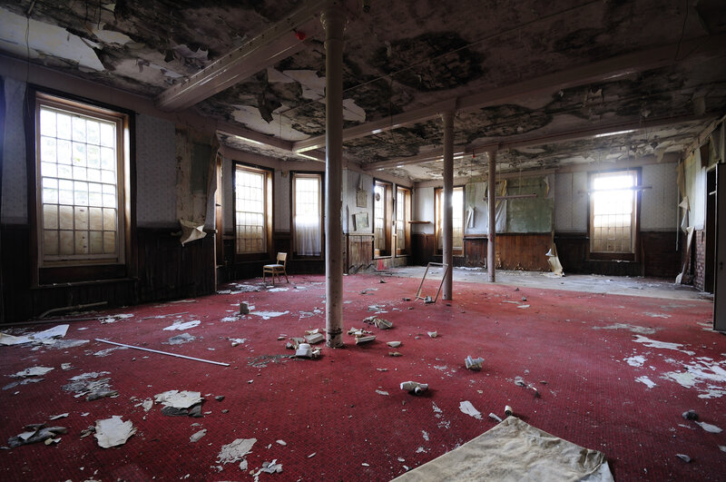 Abandoned room with red carpet