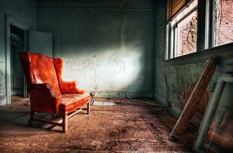 abandoned room with red chair