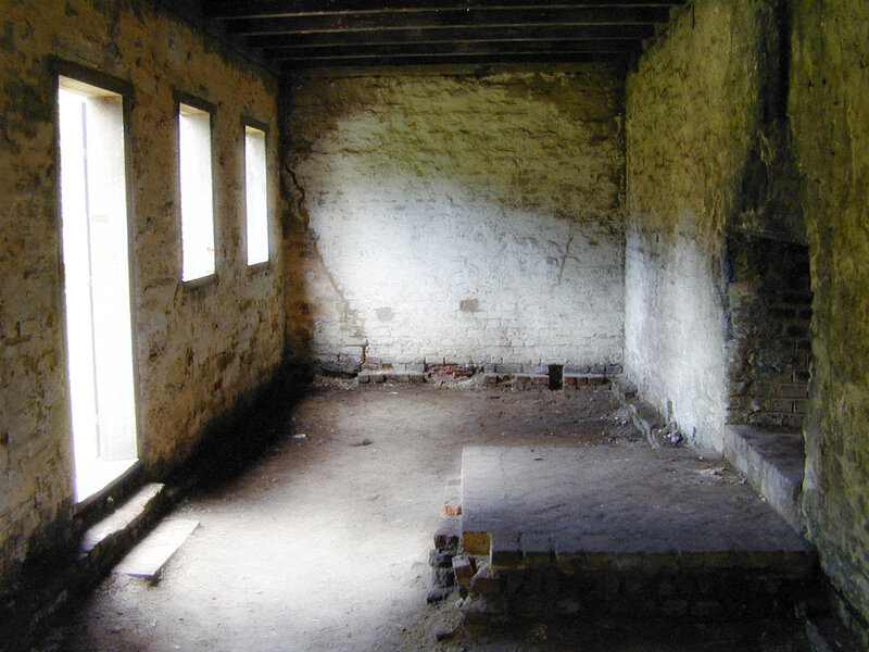 abandoned room with stone walls