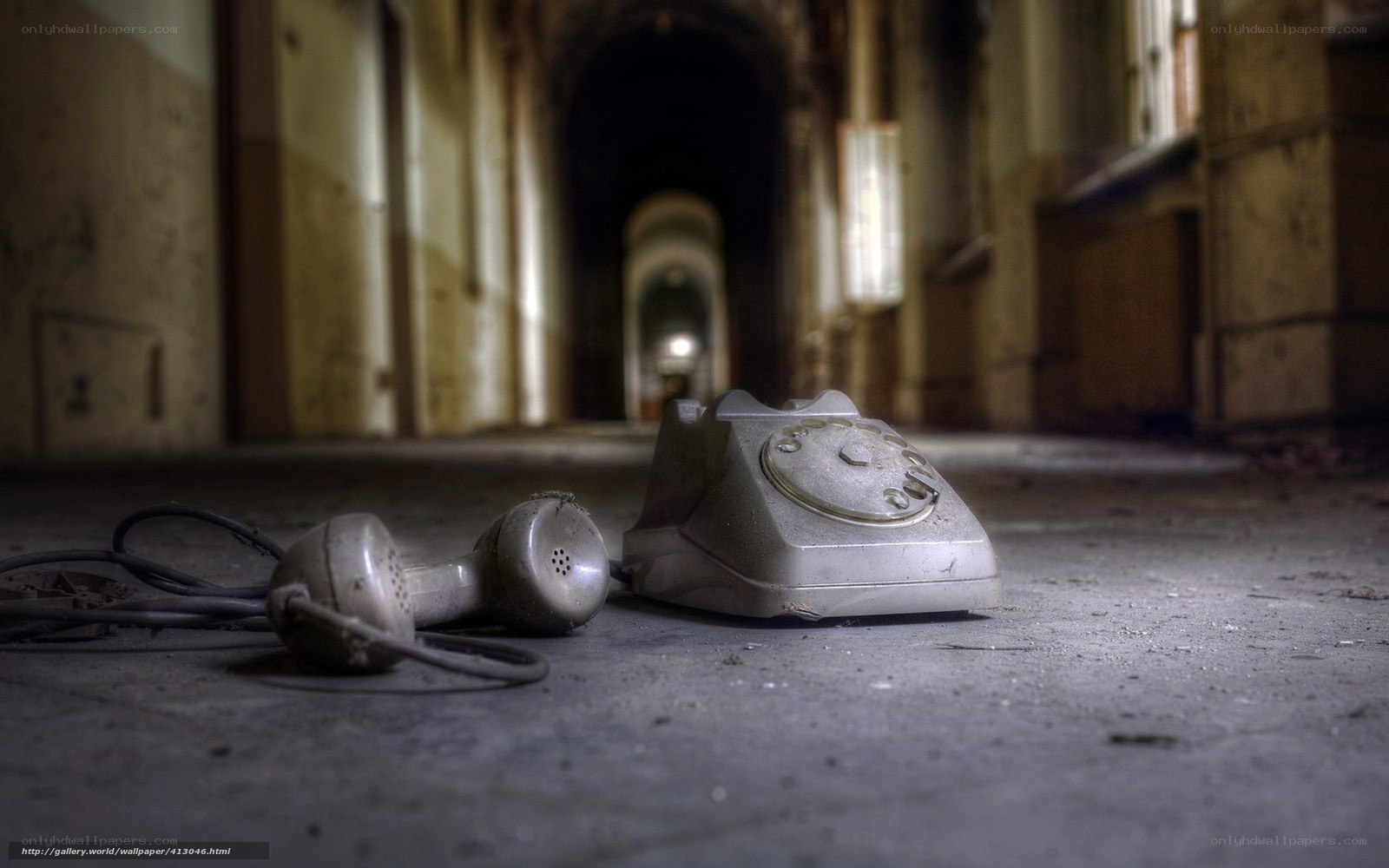 Abandoned rotary phone in a hallway