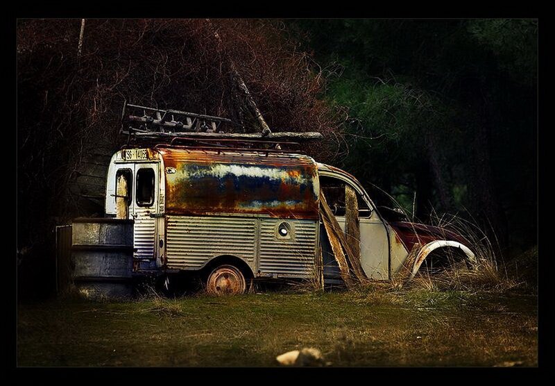 Abandoned rusted van in forest