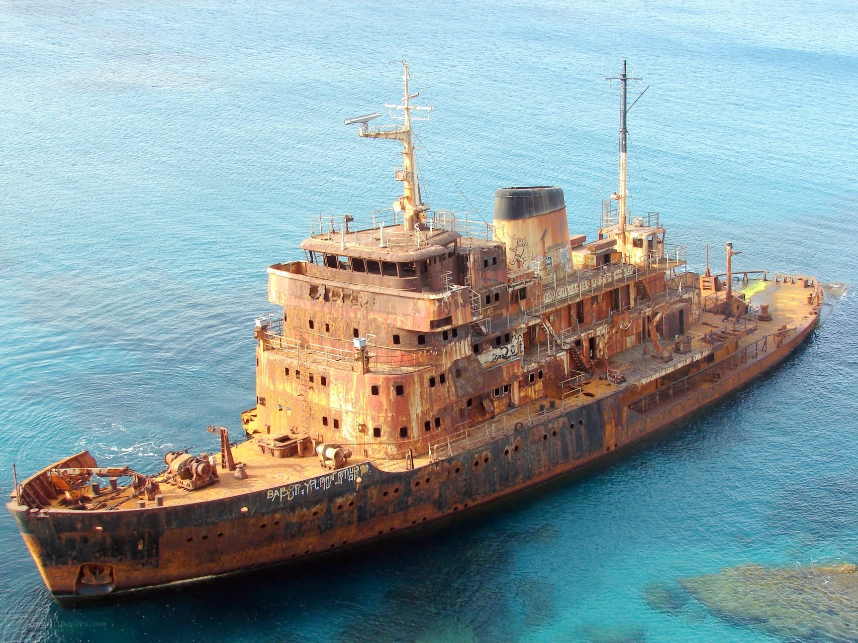abandoned ship in blue water
