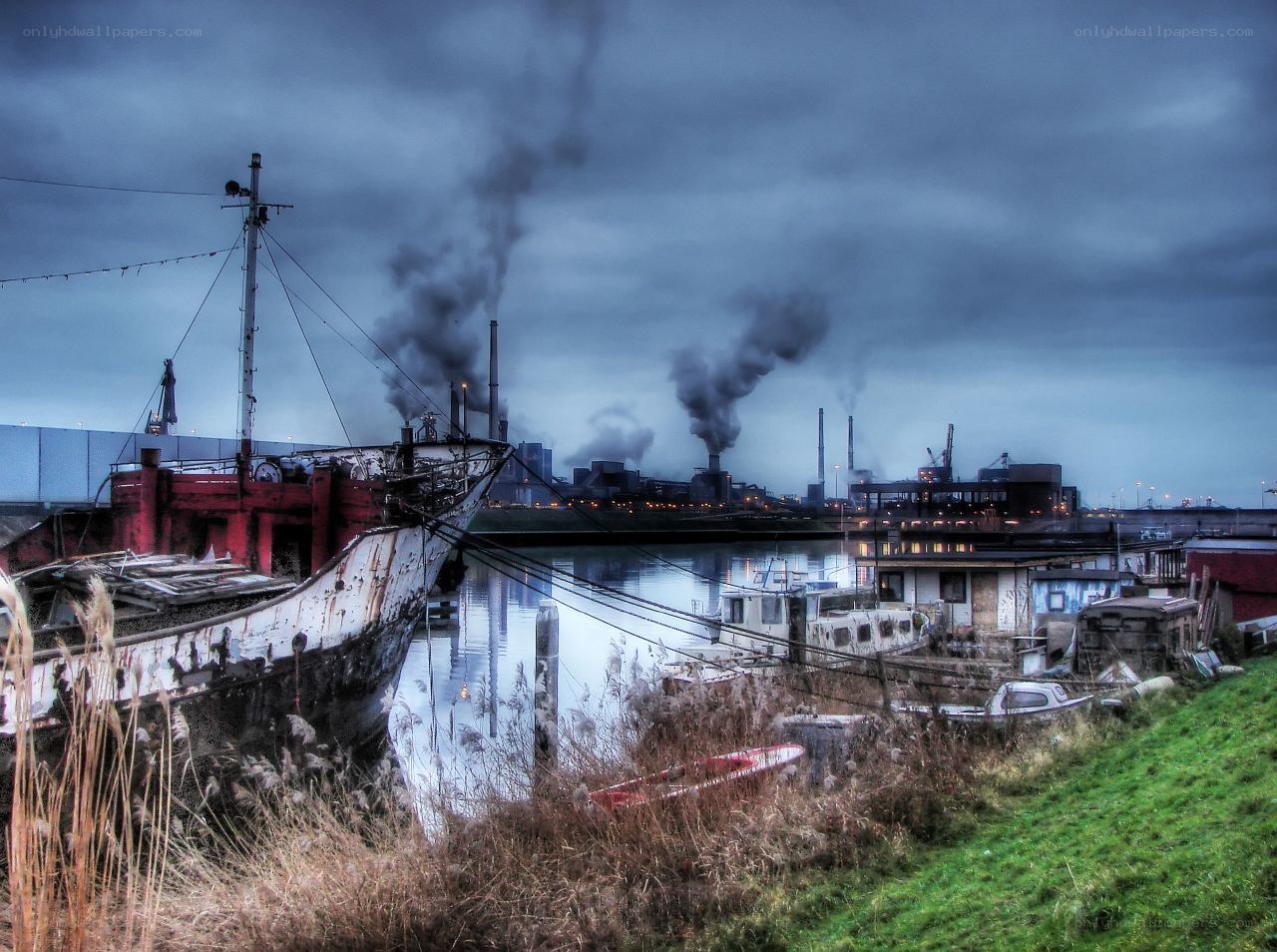 Abandoned ship in industrial harbor