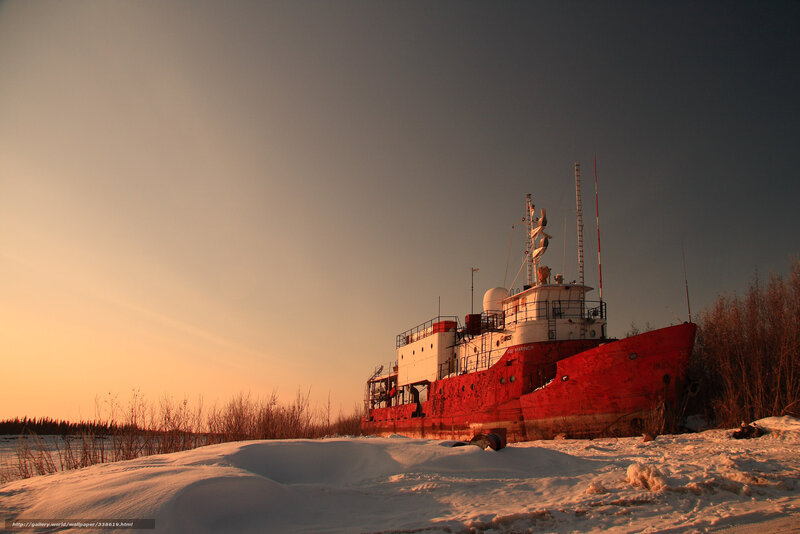 Abandoned ship in snowy landscape