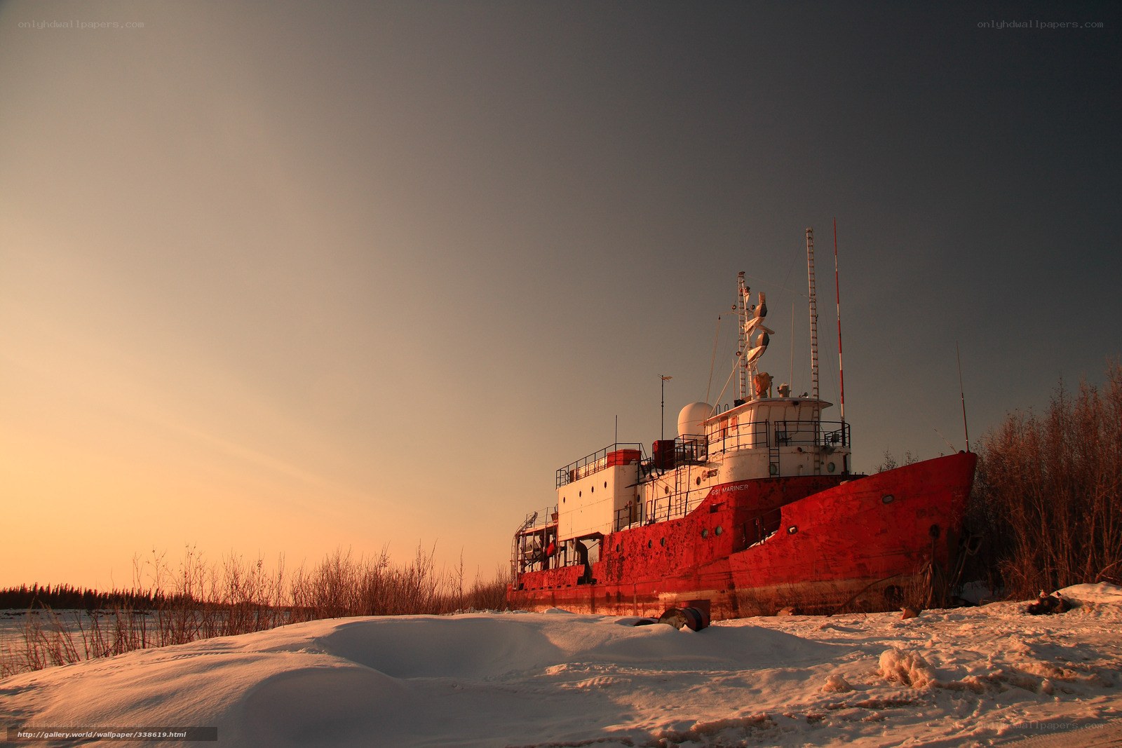 Abandoned ship in snowy landscape