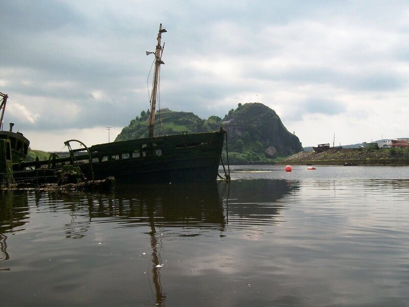 abandoned ship near rocky hill