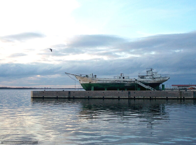 abandoned ship on a dock