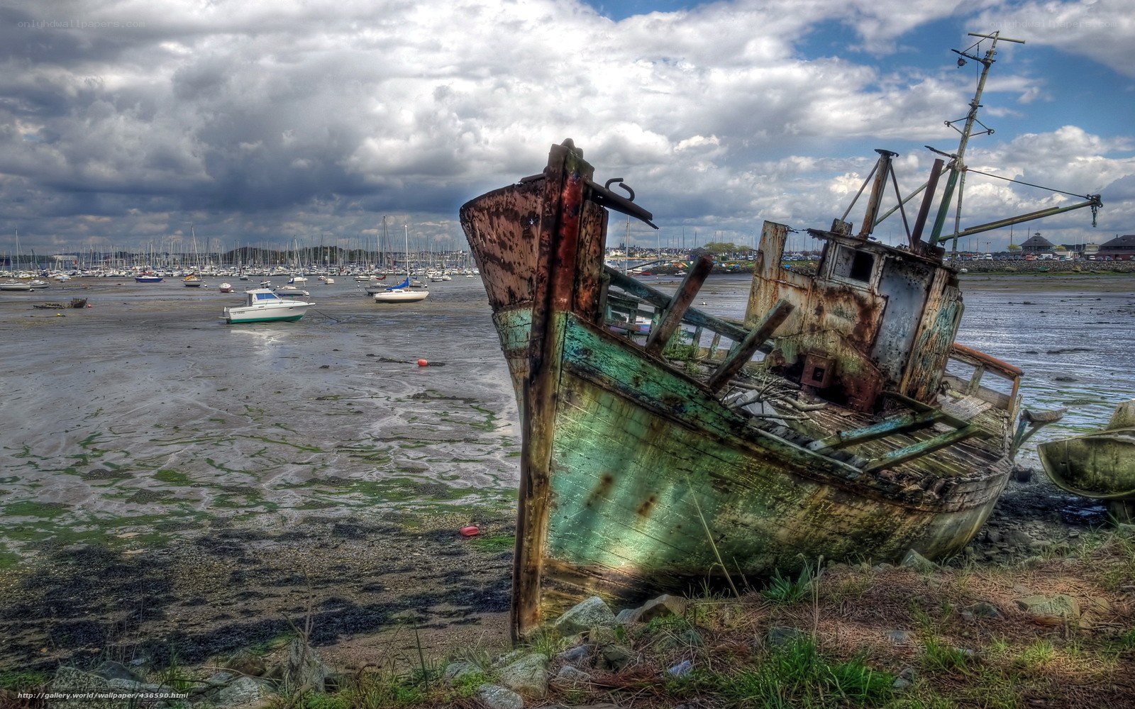 Abandoned ship on a muddy shore