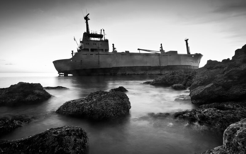 Abandoned Ship on Rocks — Black, Dramatic