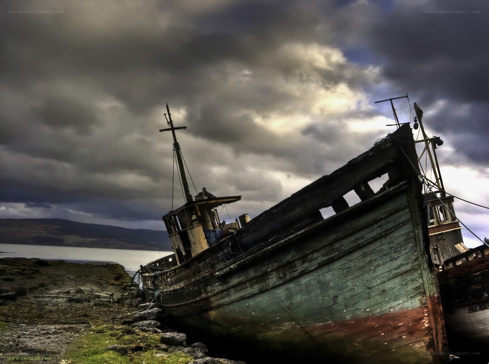 Abandoned ship on rocky shore