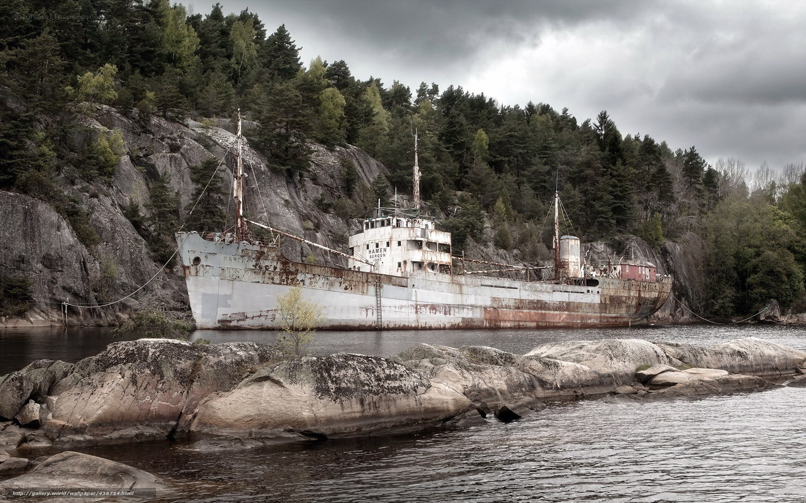 Abandoned ship on rocky shore