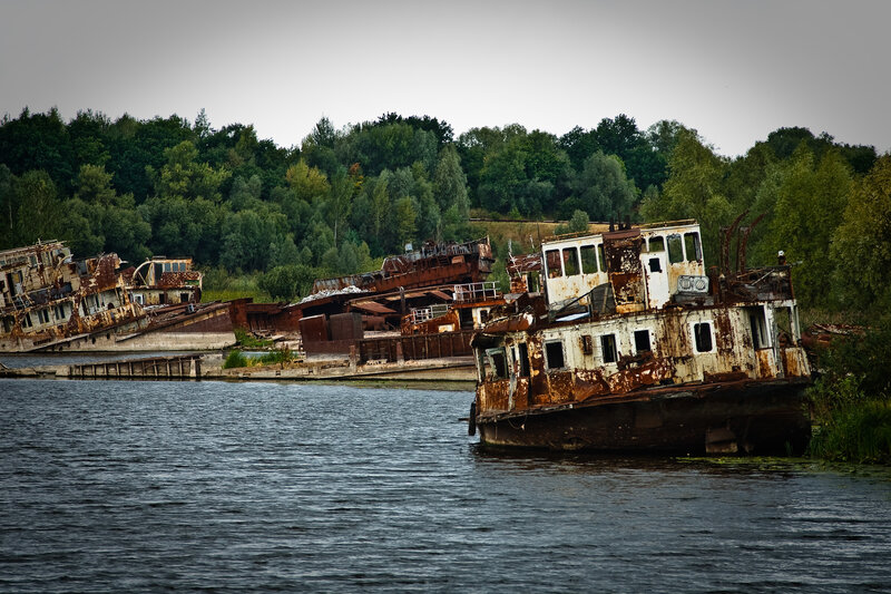 Abandoned ships on a river