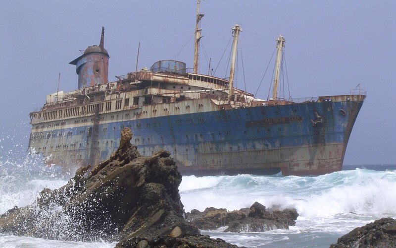 Abandoned shipwreck on rocky shore
